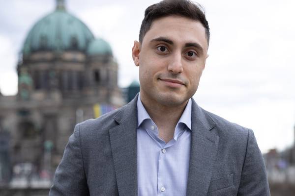Elman Huseynov in Berlin, with the Berliner Dom behind him